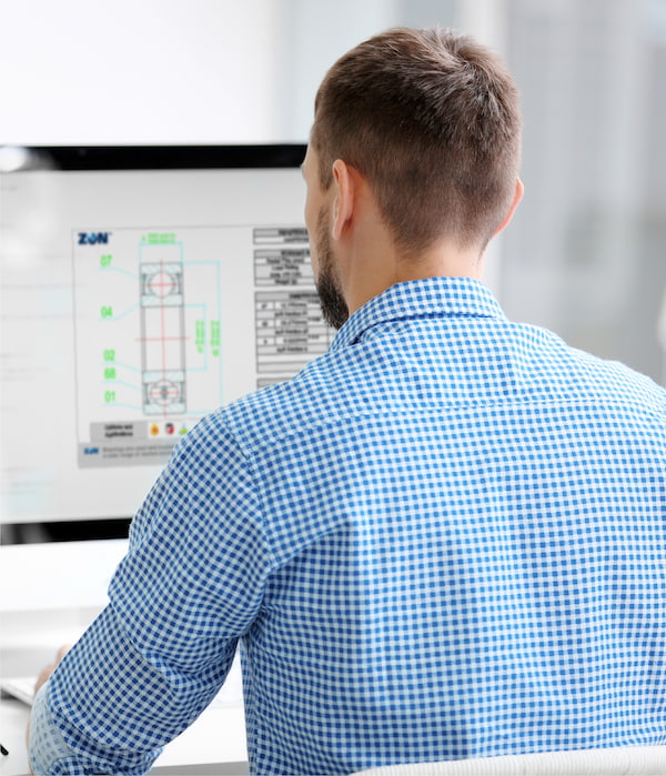 Engineer working on a bearing technical drawing on his computer